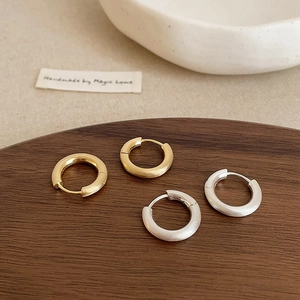 Minimalist brushed metal hoop earrings in gold and silver finish for daily wear