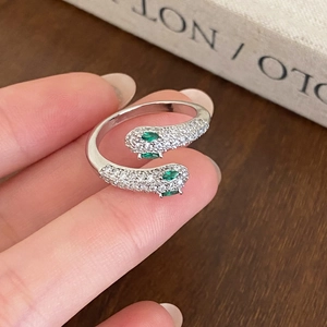 Silver snake open ring with green marquise stones and zircon pavé on dual snake heads