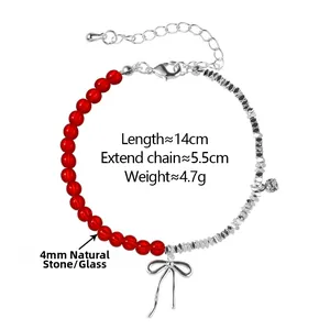 Detailed view of natural stone bracelet with silver bow charm and adjustable chain