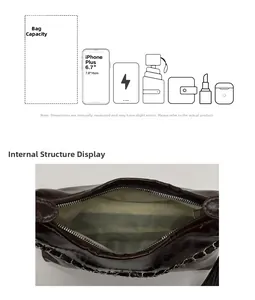 Detail view showing interior capacity of a glossy leather tote bag with silver chain