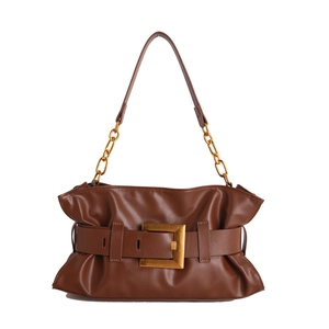 Brown pleated leather cloud bag with gold buckle and chain strap on white background