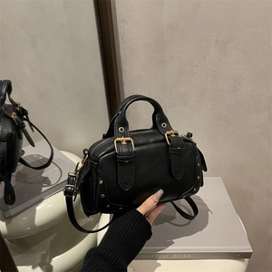 Classic black pebbled leather underarm bag with gold hardware and adjustable strap