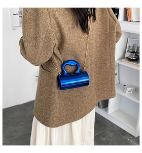 Blue cylindrical mirror finish acrylic handbag with heart handle and gold chain strap