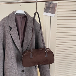 Vintage dark brown suede baguette shoulder bag shown with a grey wool blazer
