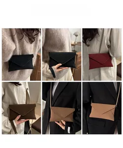 Detailed views of crossbody envelope bags in six colors with elegant gold chain straps