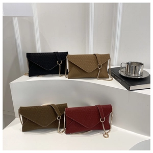 Chic textured envelope chain bags in black, khaki, green, and burgundy on display