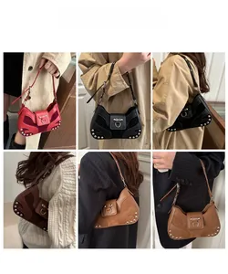 Close-up of vintage rivet shoulder bags in multiple colors featuring matte leather finish