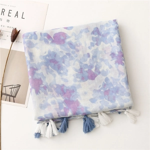 Detail of artistic ink painting pattern on linen-feel scarf with handmade tassels