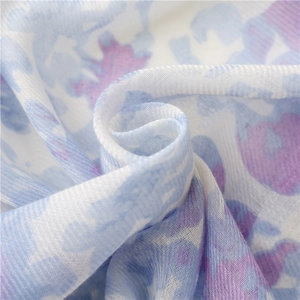 Artistic ink wash cotton-linen scarf with blue watercolor floral pattern and tassels