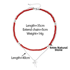 Gros plan du collier double rang en pierre naturelle avec pendentif nœud et dimensions