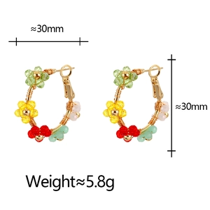 Bohemian style beaded flower hoop earrings with gold wire and colorful floral accents
