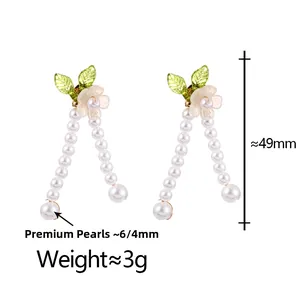 Detailed view of floral pearl earrings with 49mm length and 3g weight specifications