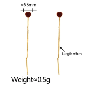 Detailed view of gold heart tassel earrings with dimensions: 6.5mm width and 5cm length