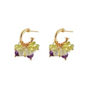 Elegant gold hoop earrings with natural green crystals and purple beads on white background