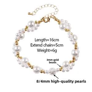 Detailed view of layered pearl bracelet with gold beads, lobster clasp, and extension chain