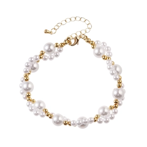 Detailed shot of elegant pearl bracelet with gold beads and adjustable lobster clasp