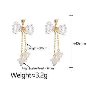 Elegant bow-knot pearl tassel drop earrings with gold chains and petal charms for women