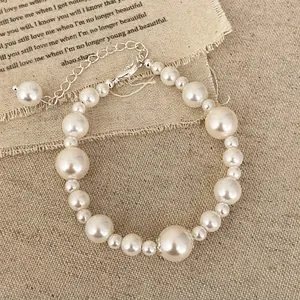 Elegant vintage pearl bracelet with white pearls and silver adjustable chain for women