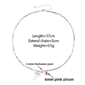 Detail of pearl and pink zircon bow necklace showing 37cm length and fine metal chain