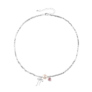 Elegant pearl necklace with silver bow and pink heart crystal on white background