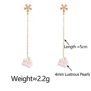 Elegant gold flower pearl tassel earrings featuring champagne zircon and long chain drop