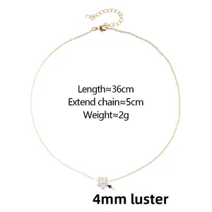 Detail of pearl flower pendant necklace with gold chain lobster clasp and extension