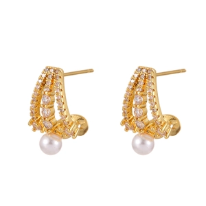 Detail of elegant gold stud earrings featuring micro-paved zircons and a white pearl drop