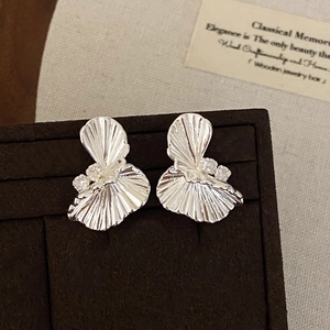 Silver twisted fan earrings with zircon accents displayed in a luxury jewelry box