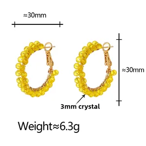 Detail view of 30mm yellow crystal hoop earrings with 6.3g weight specifications