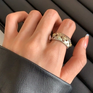 Vintage wide band ring with silver brushed metal finish and gold zircon stars