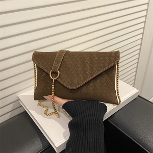 Deep brown envelope clutch bag with woven texture and gold chain strap for women