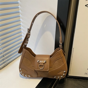 Brown vintage motorcycle underarm bag with silver studs and premium leather stitching