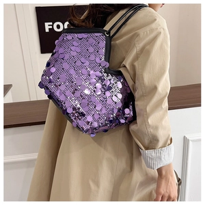 Detail of purple sequin handbag shoulder bag with large round glitter accents and strap