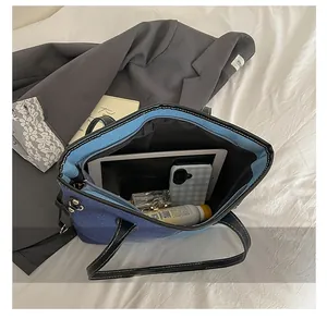 Internal view of the large capacity tote bag showing space for a tablet and daily items
