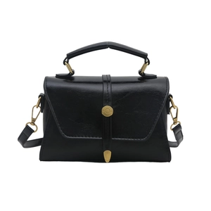 Classic black trapezoid handbag with gold buckle and adjustable shoulder strap