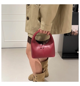 Detail showing vintage wine red leather hobo bag with top handle and double zipper