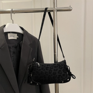 Black matte leopard print shoulder bag with side bow drawstring and rivet details