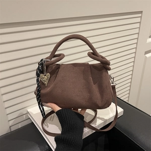 Retro dark brown suede handbag with creative knot handle and heart charm detail