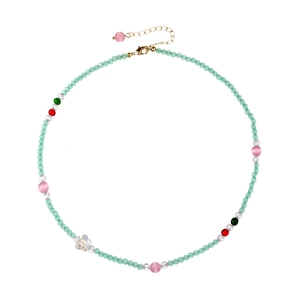 Beaded necklace with light green crystals, pink cat-eye stones, and gold lobster clasp