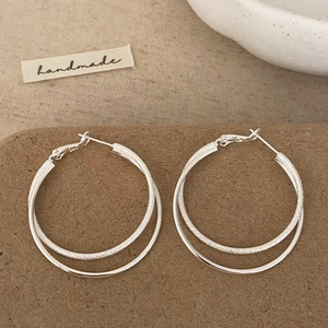Minimalist double layered silver hoop earrings with mixed polished and frosted texture