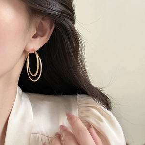 Elegant gold double layer hoop earrings for women with polished and textured finish