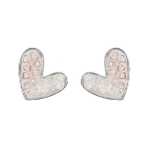 Detailed view of pink crystal heart earrings with silver honeycomb texture and tassel