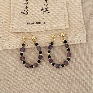 Sweet beaded drop earrings with purple square crystals and black faceted beads on gold pins