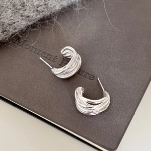 Chic silver layered C-shaped wire wrapped stud earrings with intricate beaded texture