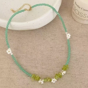 Charming green crystal bead necklace with small white flowers and gold extension chain