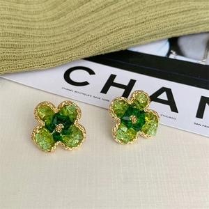 Elegant green crystal flower stud earrings with a gold twisted metal frame for women