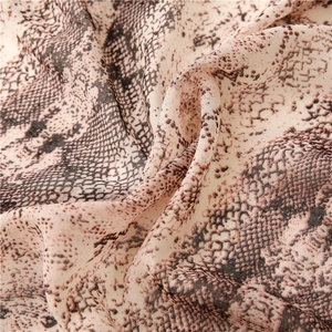 Detailed close-up of snakeskin pattern on soft, lightweight breathable fabric scarf