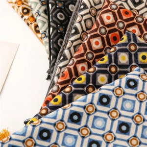 Detail of geometric diamond pattern scarves showing rich texture and multiple colors