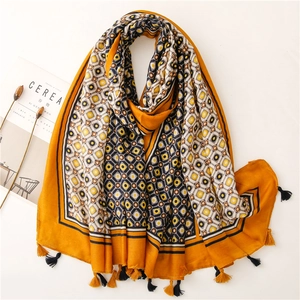Mustard yellow cotton scarf with geometric diamond patterns and fringe tassels