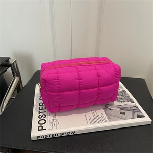 Bright rose pink quilted nylon makeup bag with chic checkered stitching and gold zipper